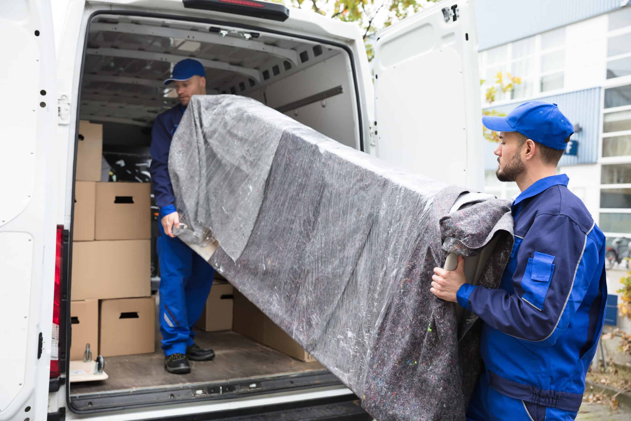 Dunbar Moving Company's professionals handling the relocation of a couch with precision and safety, providing top-tier moving services across Long Island