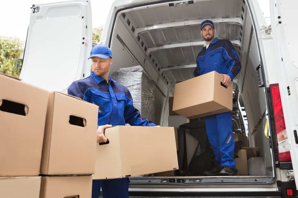 Professional removalists loading moving boxes into a Dunbar Moving van. Trusted local moving company for residential and commercial relocations.