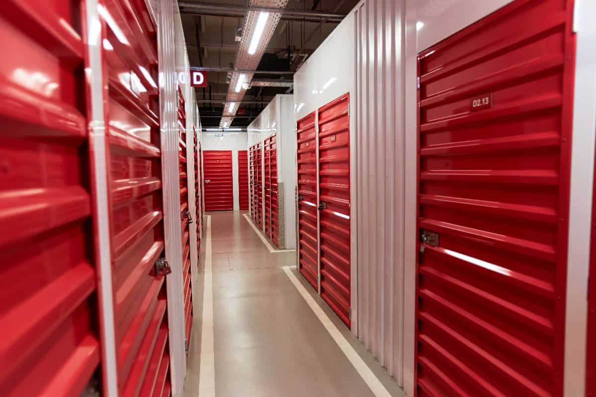 Red storage unit doors in a self-storage facility for move-in and storage solutions.